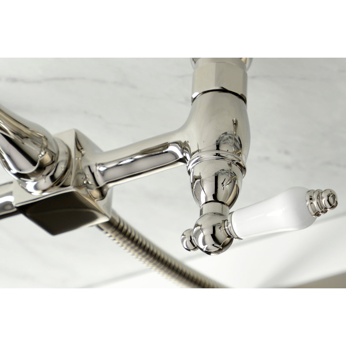 Kingston Brass KS1243PLBS Heritage Wall Mount Bridge Kitchen Faucet with Brass Spray