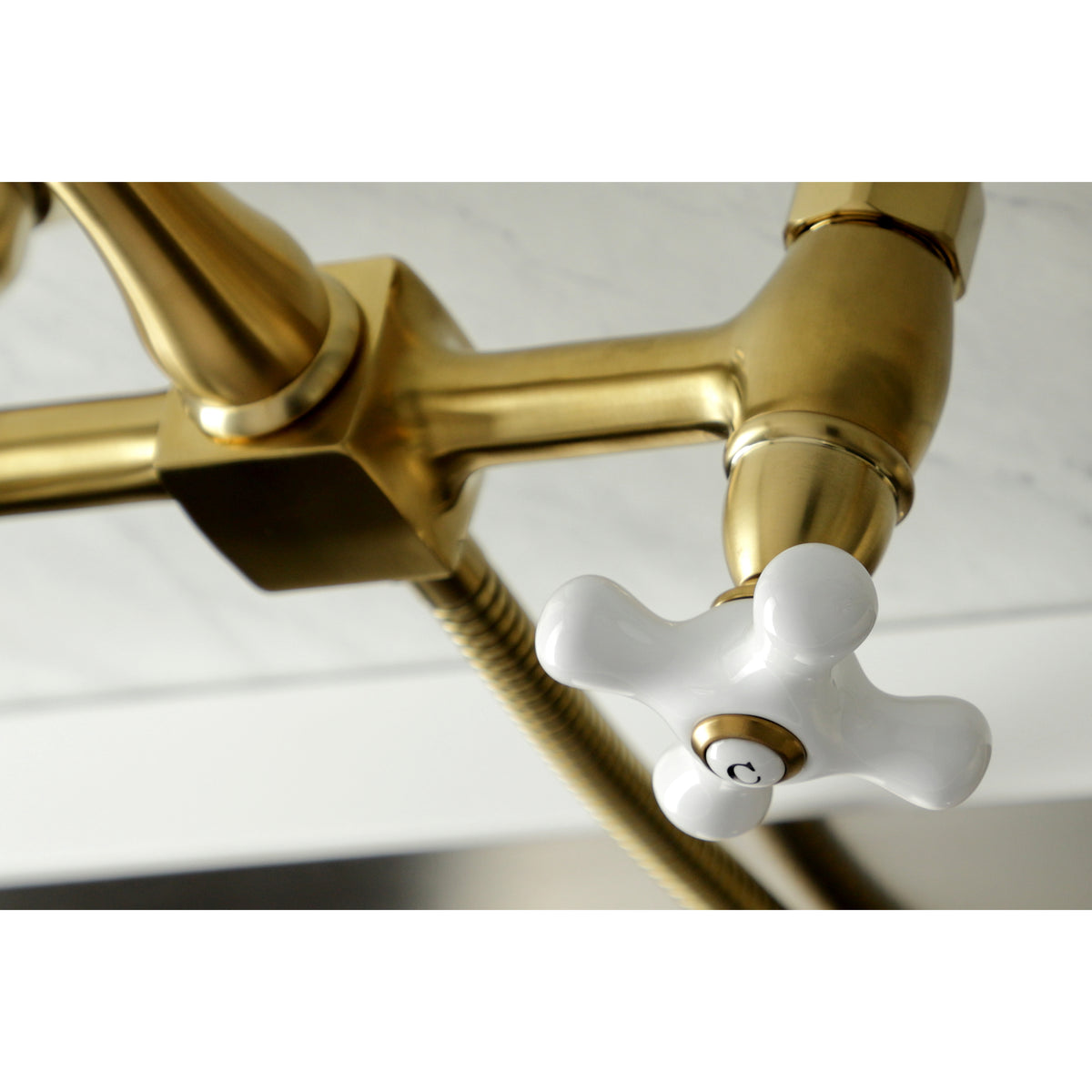 Kingston Brass KS1261PXBS Heritage Wall Mount Bridge Kitchen Faucet with Brass Sprayer