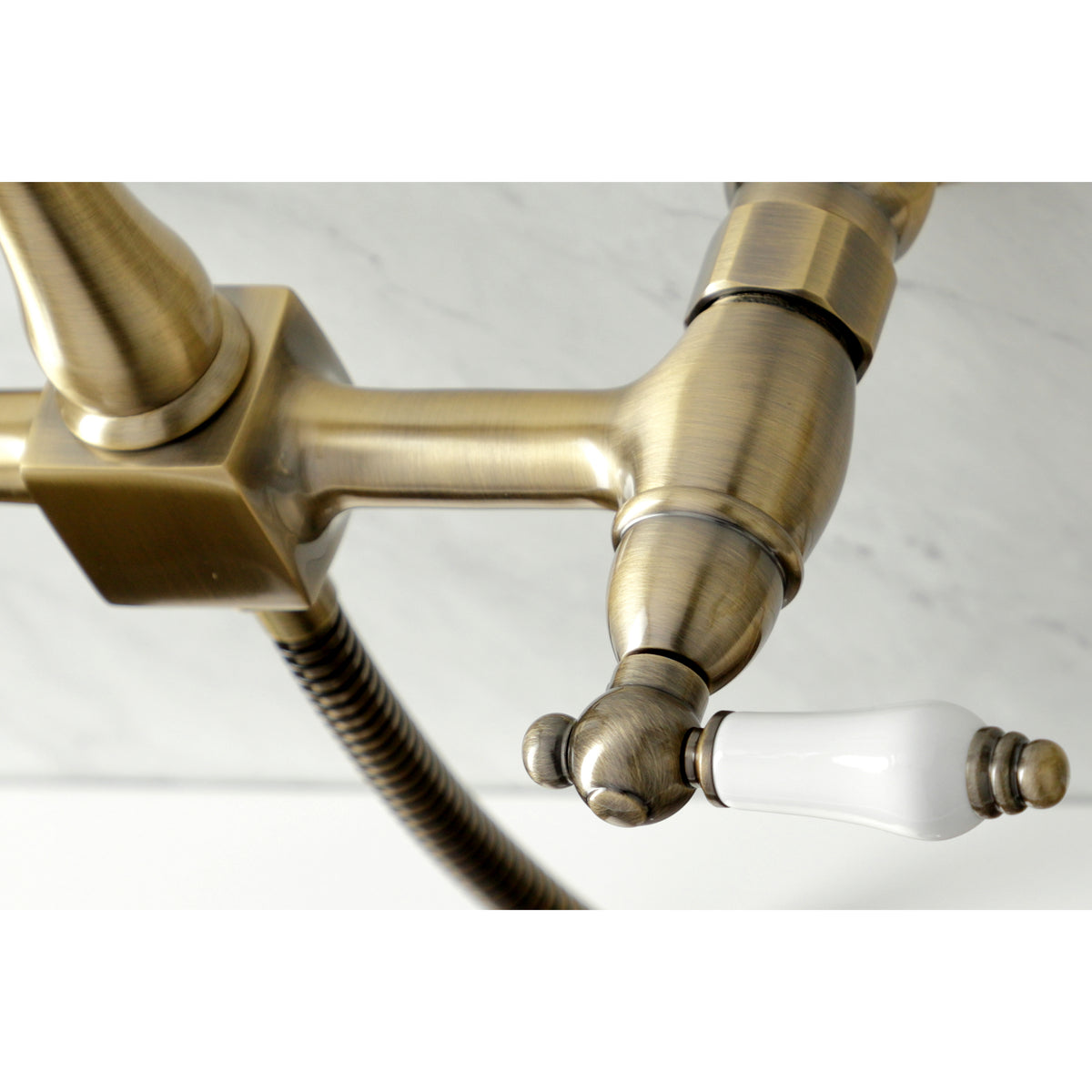 Kingston Brass KS1243PLBS Heritage Wall Mount Bridge Kitchen Faucet with Brass Spray