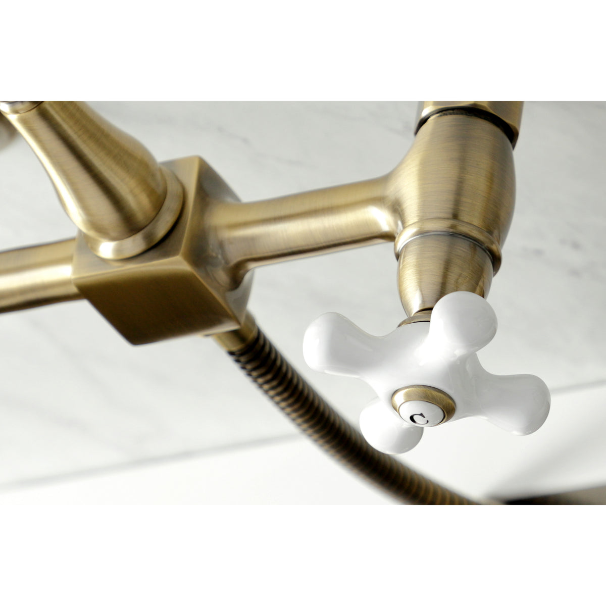 Kingston Brass KS1242PXBS Heritage Wall Mount Bridge Kitchen Faucet with Brass Spray